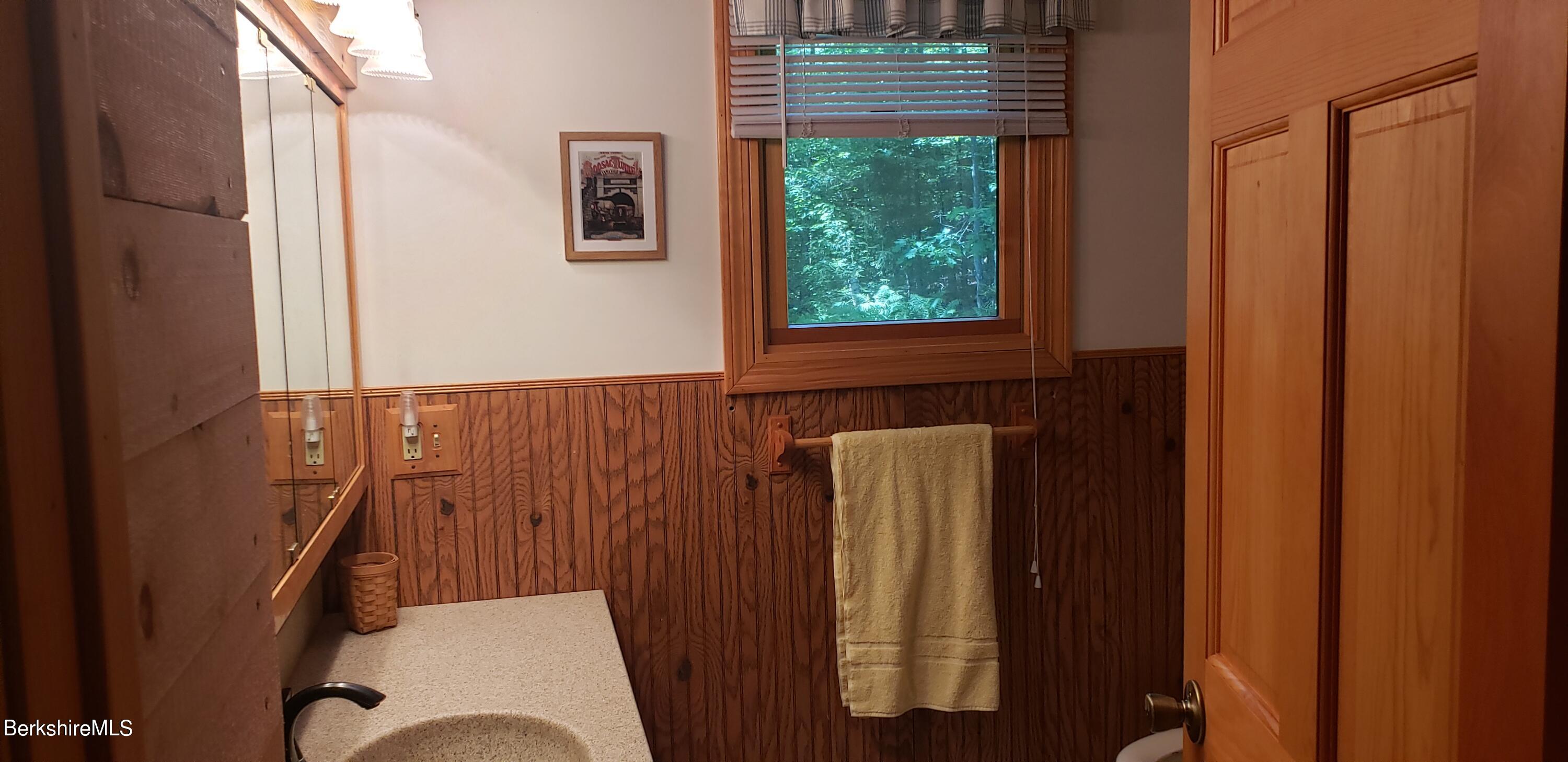 110 Strykers Road Florida, MA 01247 - Photo 12 of 20 a bathroom with a sink and a mirror