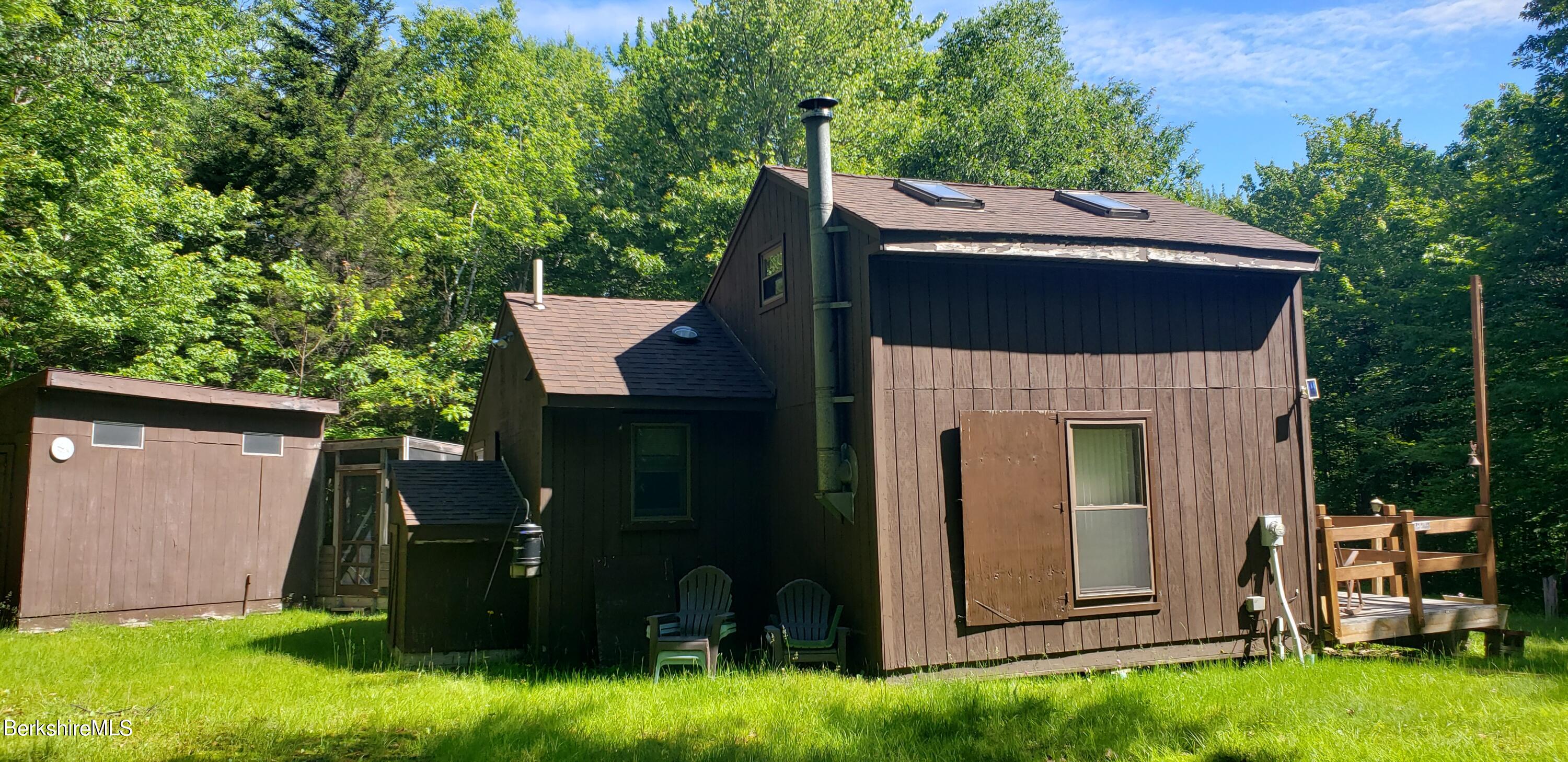 110 Strykers Road Florida, MA 01247 - Photo 2 of 20 front view of a house with a yard