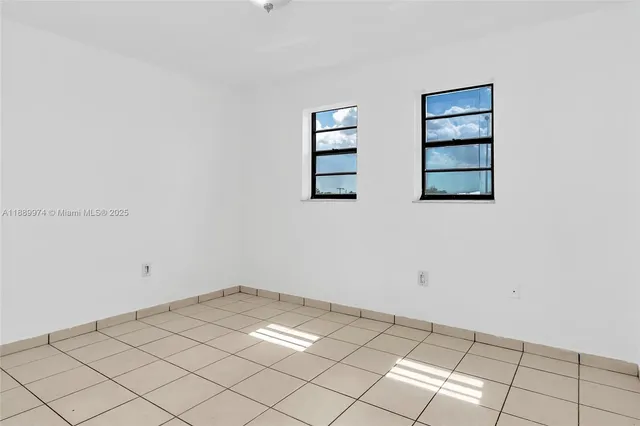 a view of a room with white walls