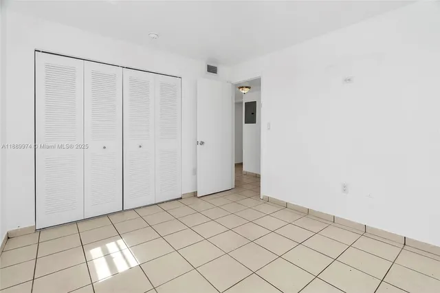 a view of an empty room and window