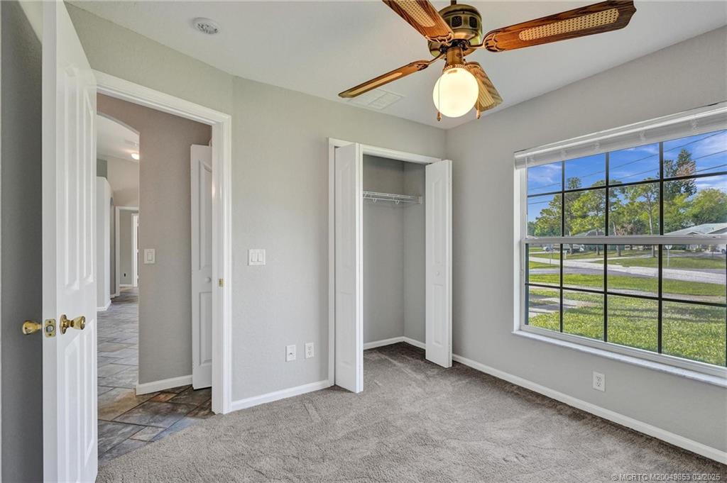 5902 Yucca Drive Fort Pierce, FL 34982 - Photo 20 of 83 wooden floor in an empty room with a window