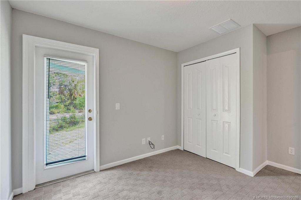 5902 Yucca Drive Fort Pierce, FL 34982 - Photo 24 of 83 a view of an empty room with a window