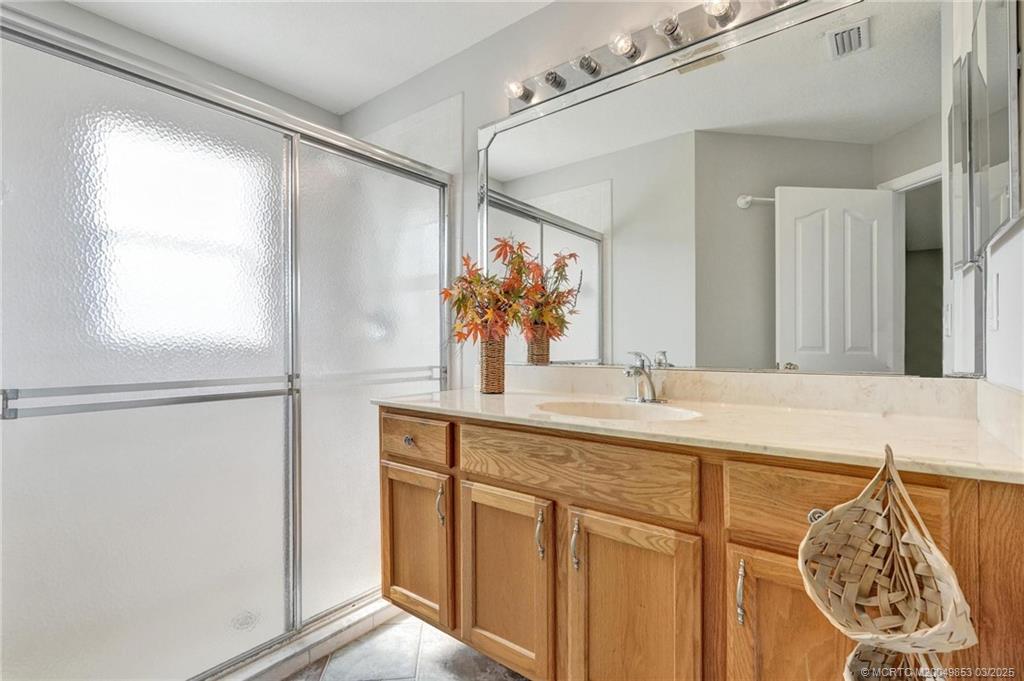 5902 Yucca Drive Fort Pierce, FL 34982 - Photo 33 of 83 a bathroom with a sink and a mirror