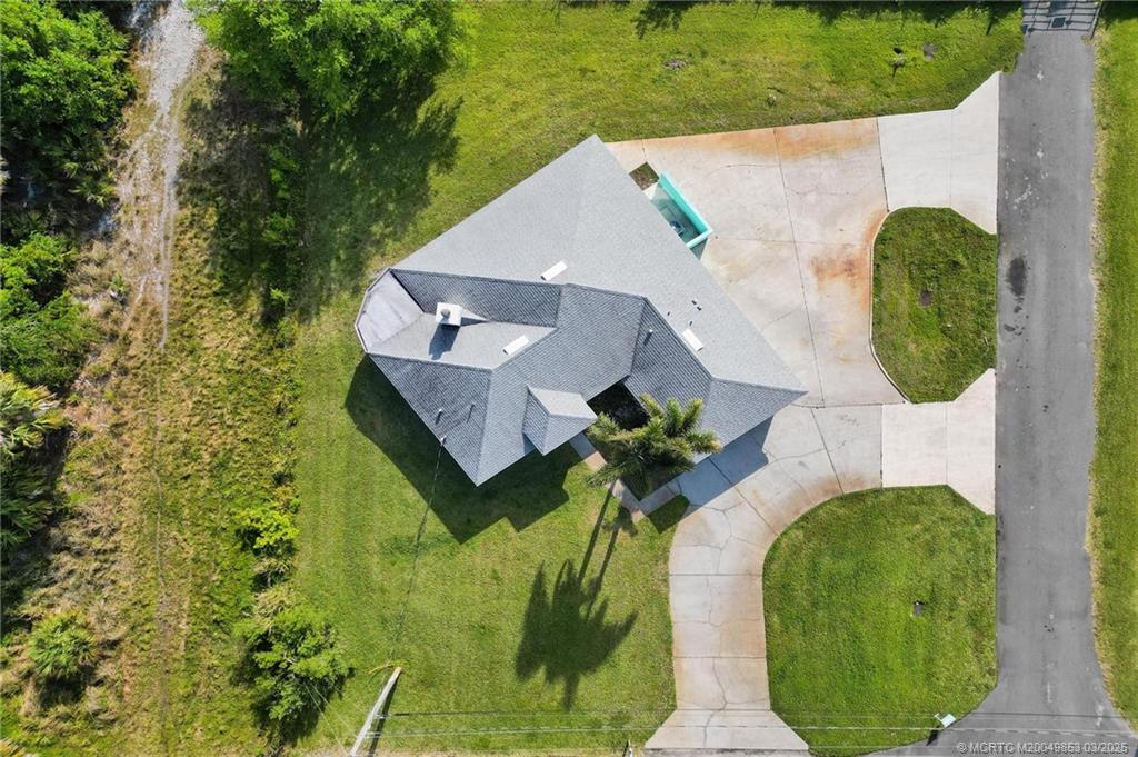 5902 Yucca Drive Fort Pierce, FL 34982 - Photo 52 of 83 an aerial view of a house with garden space and street view