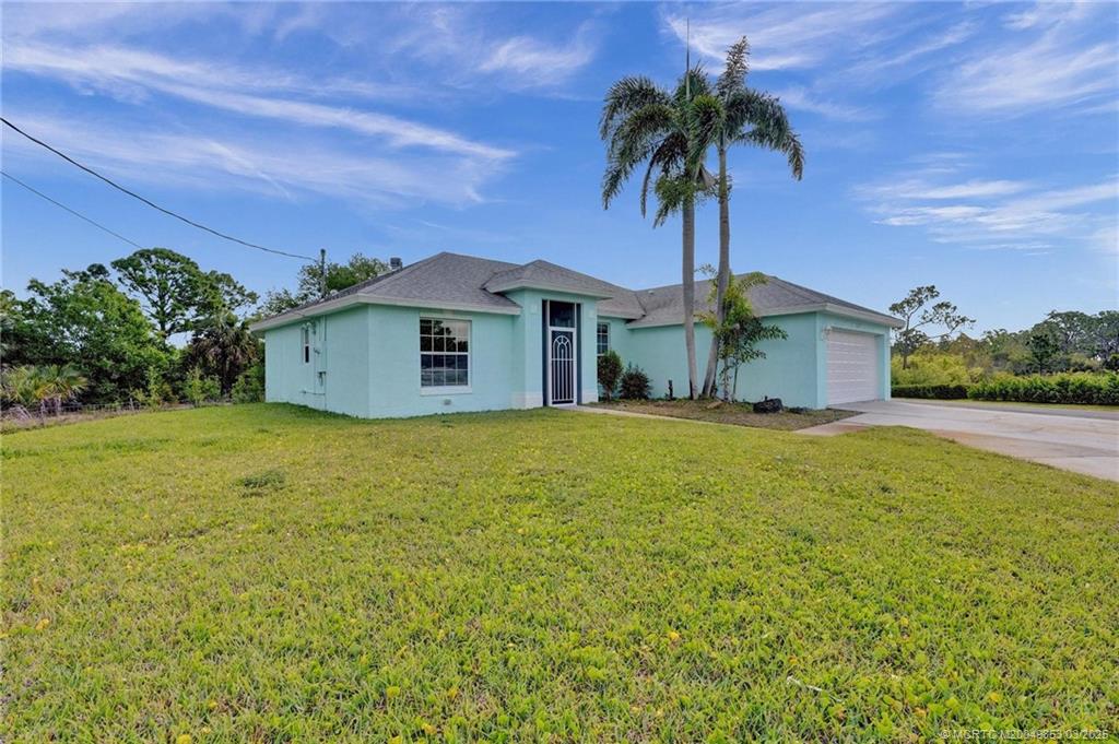 5902 Yucca Drive Fort Pierce, FL 34982 - Photo 62 of 83 a house view with a garden space
