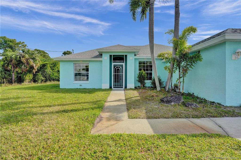 5902 Yucca Drive Fort Pierce, FL 34982 - Photo 68 of 83 a front view of a house with garden