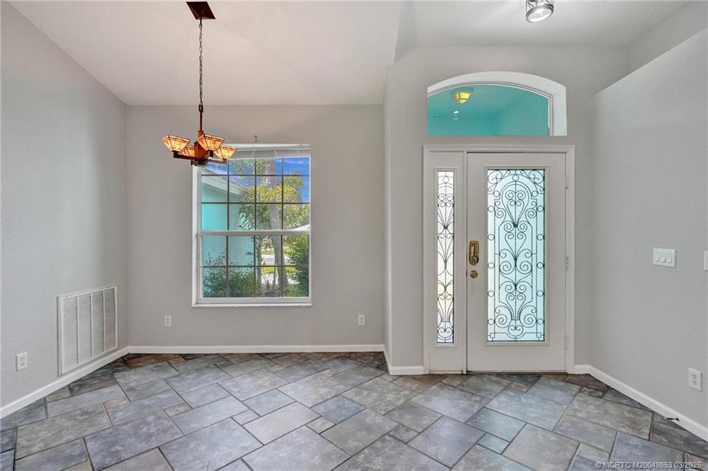 5902 Yucca Drive Fort Pierce, FL 34982 - Photo 7 of 83 a view of an empty room with a window