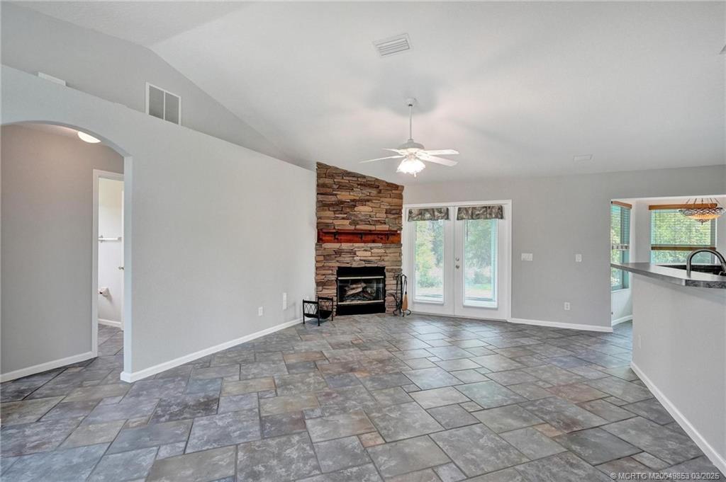 5902 Yucca Drive Fort Pierce, FL 34982 - Photo 8 of 83 a view of an empty room with fire place and a window