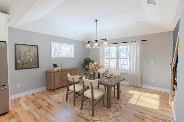 a dining room with furniture and window