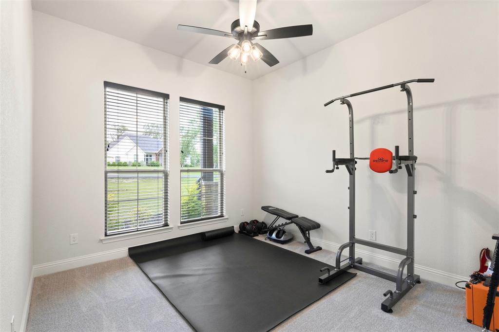 105 Clayton Crossing Springtown, TX 76082 - Photo 22 of 40 a view of a room with gym equipment