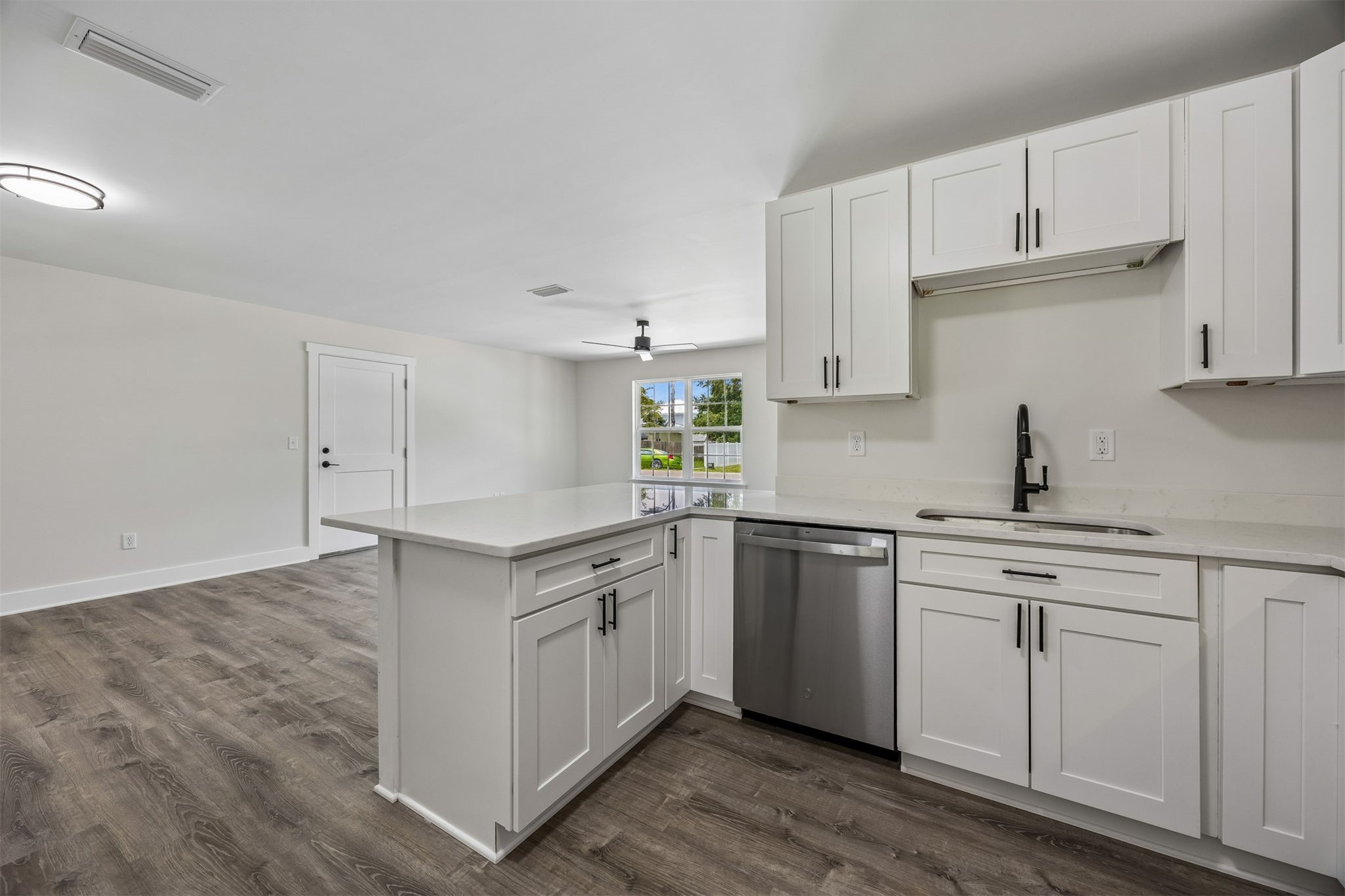 552 Sunset Road Fernandina Beach, FL 32034 - Photo 8 of 23 a kitchen with white cabinets appliances and a sink