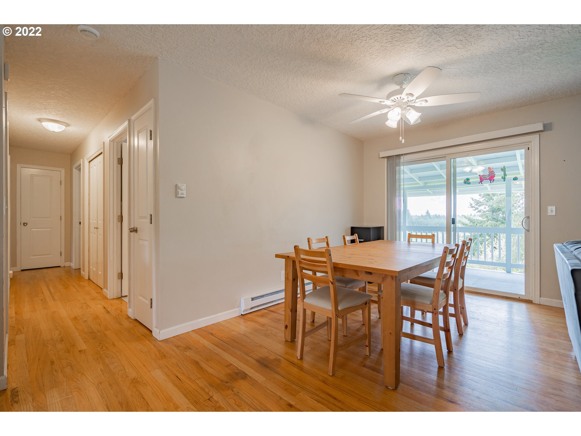 26415 Northeast Brunner Road Camas, WA 98607 - Photo 8 of 32 a view of a dining room with furniture window and wooden floor