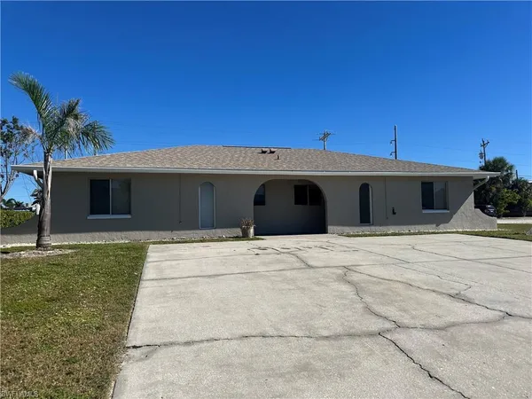 a front view of a house with a garage
