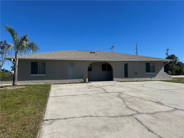 a front view of a house with a garage