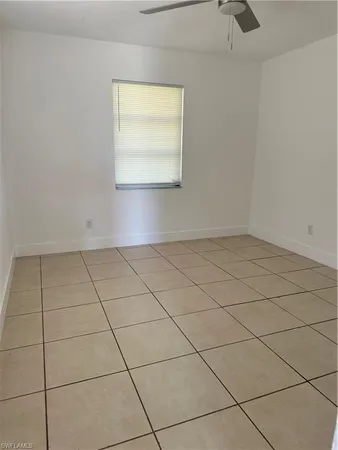 a view of an empty room and a window