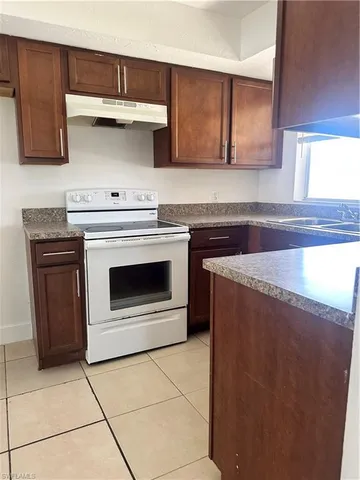 a kitchen with a stove and a microwave