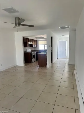 a living room with a black white checkered floor