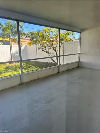 a view of an empty room with a large window