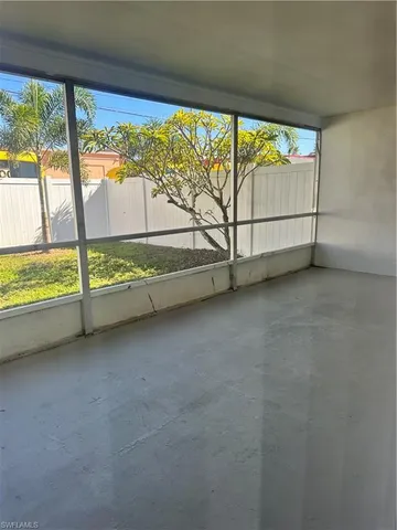 a view of an empty room with a large window