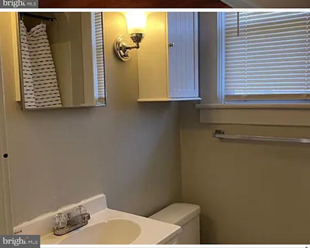 2800 Linwood Avenue, Unit C Baltimore, MD 21234 - Photo 14 of 18 a bathroom with a sink and a mirror