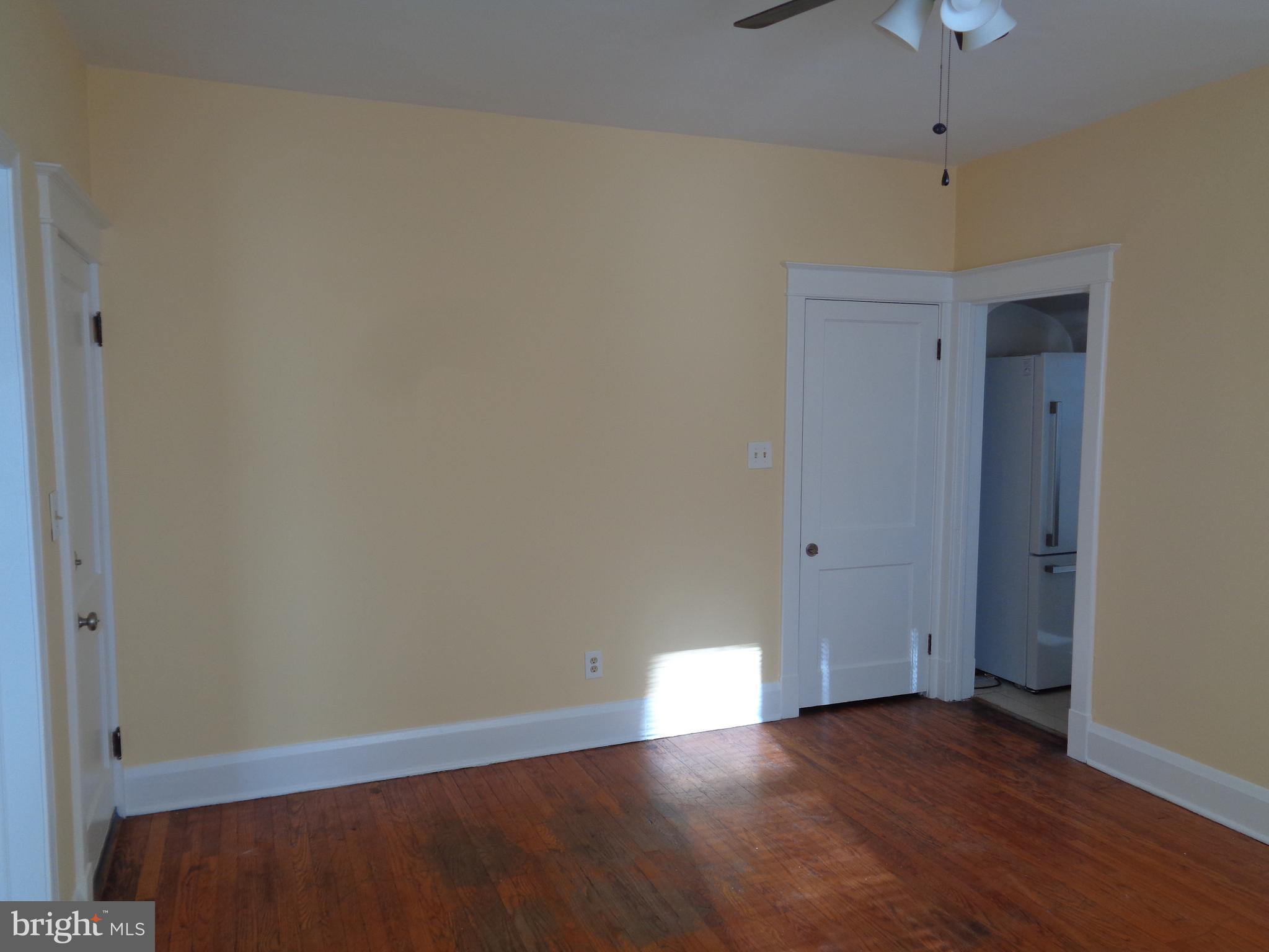 2800 Linwood Avenue, Unit C Baltimore, MD 21234 - Photo 3 of 18 a view of an empty room with wooden floor