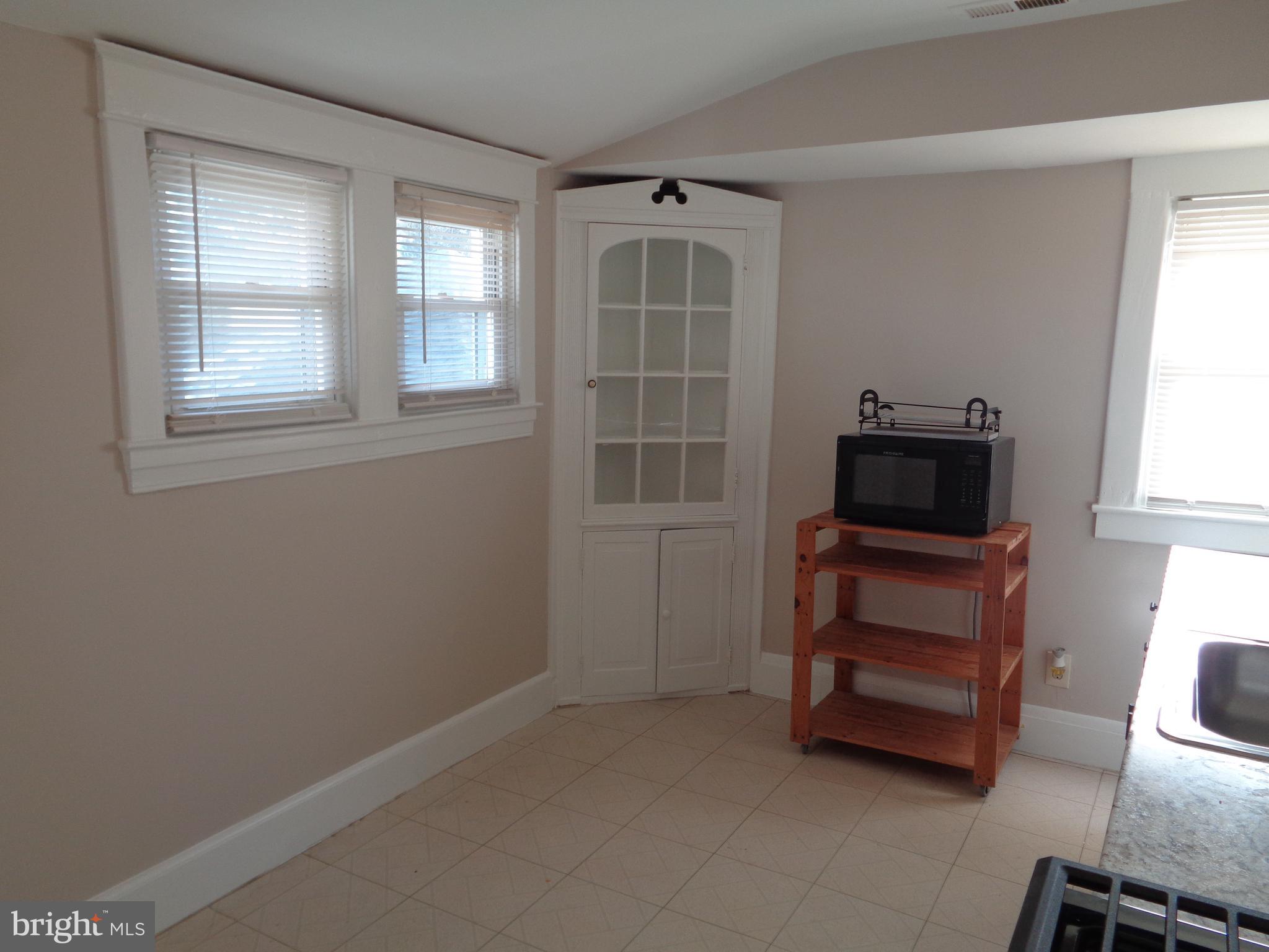 2800 Linwood Avenue, Unit C Baltimore, MD 21234 - Photo 6 of 18 an empty room with furniture and windows