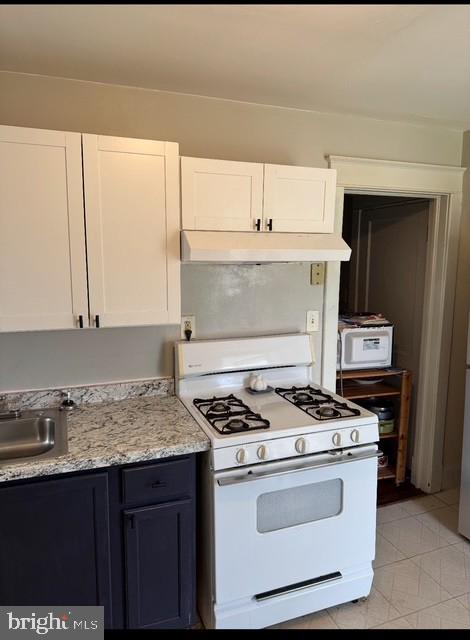 2800 Linwood Avenue, Unit C Baltimore, MD 21234 - Photo 8 of 18 a kitchen with granite countertop a stove and a sink