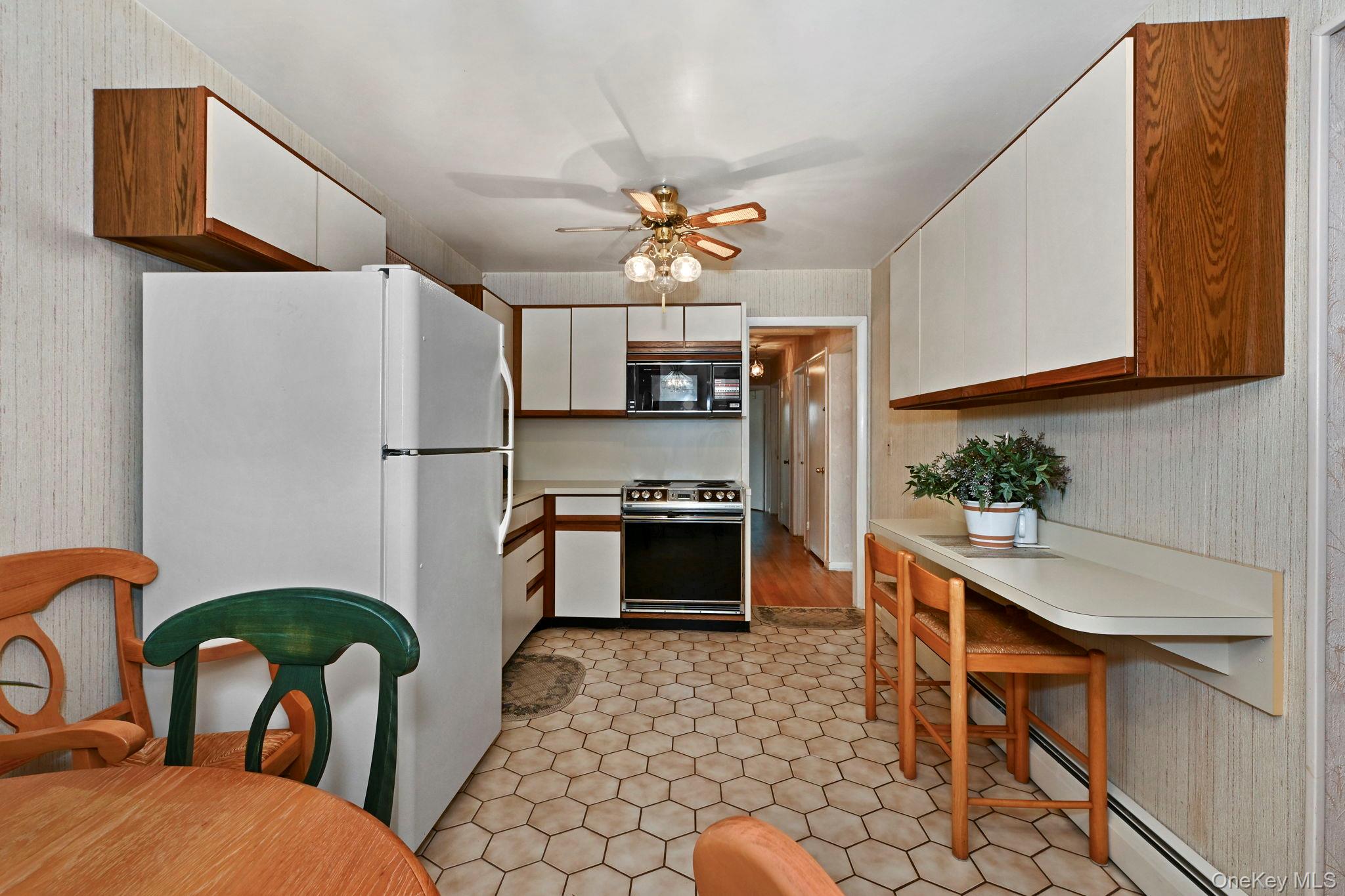 93 Fairmont Road Mahopac, NY 10541 - Photo 11 of 37 a kitchen with stainless steel appliances a stove a sink and a refrigerator