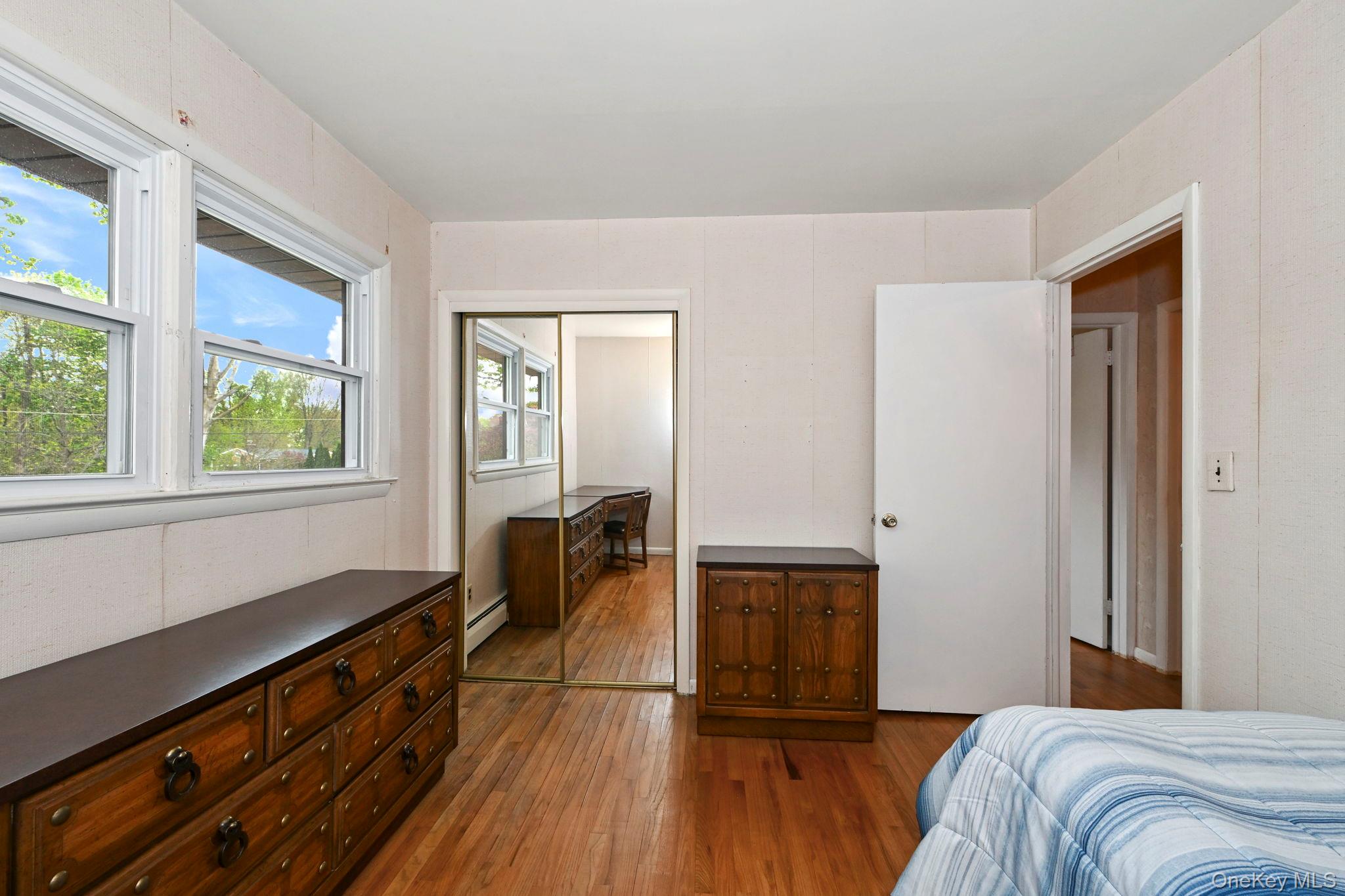 93 Fairmont Road Mahopac, NY 10541 - Photo 15 of 37 a bedroom with a bed and wooden floor