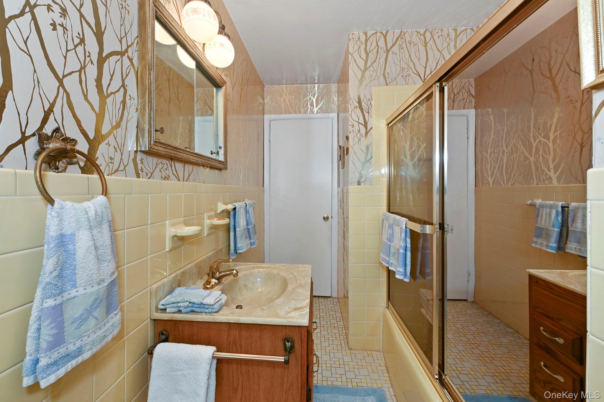 93 Fairmont Road Mahopac, NY 10541 - Photo 20 of 37 a bathroom with a granite countertop sink a mirror and shower