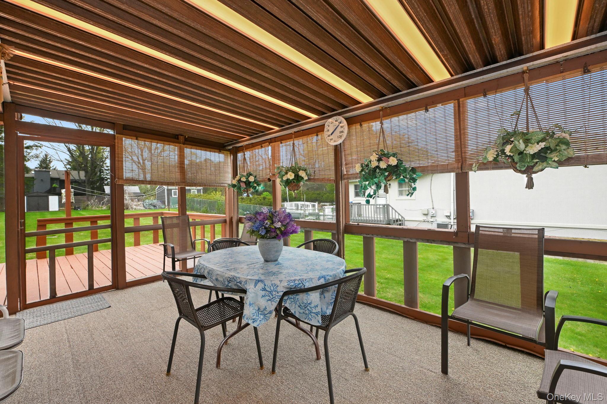 93 Fairmont Road Mahopac, NY 10541 - Photo 24 of 37 a view of a patio with a table chairs and a backyard