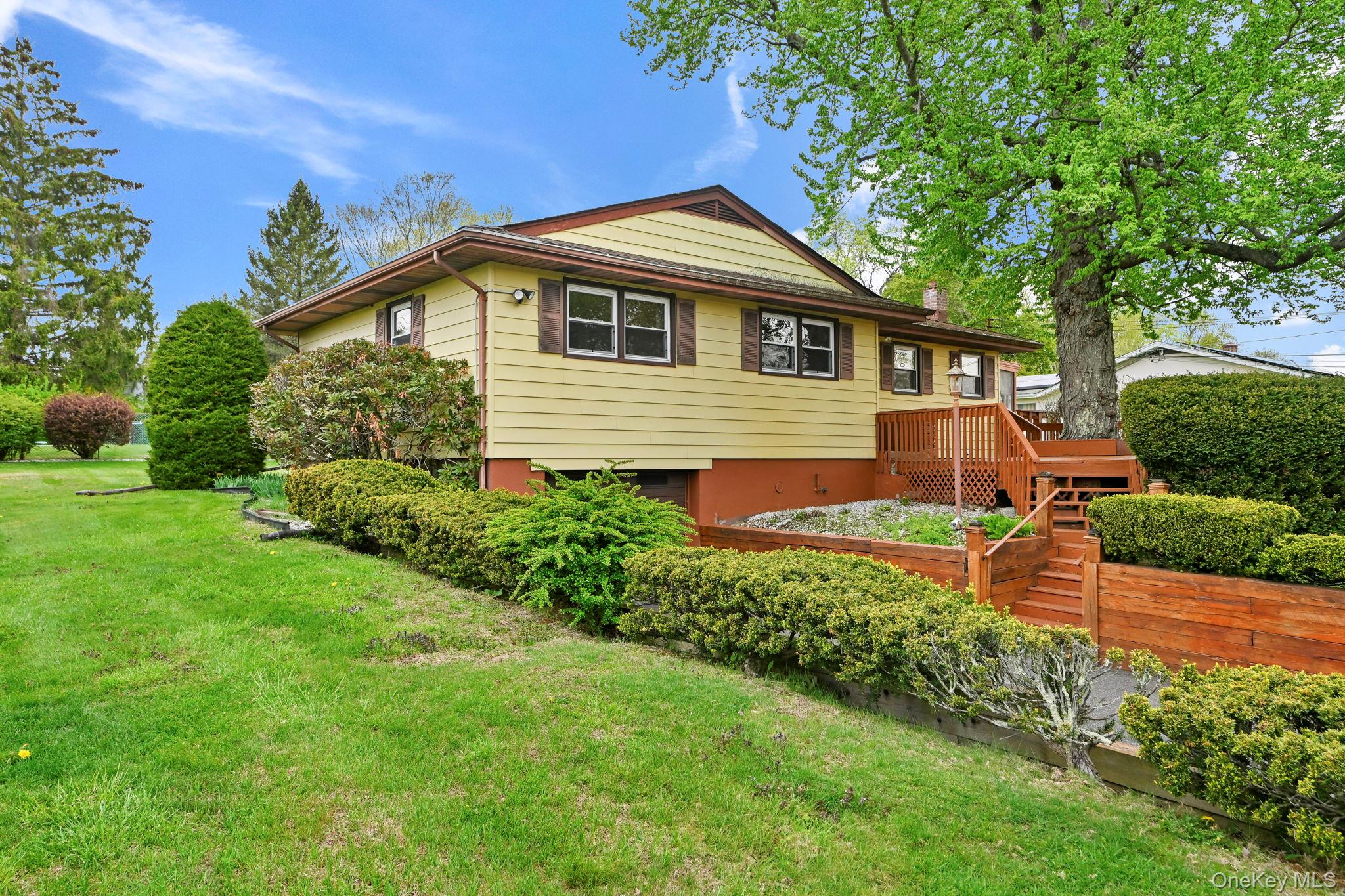 93 Fairmont Road Mahopac, NY 10541 - Photo 3 of 37 a front view of a house with a yard