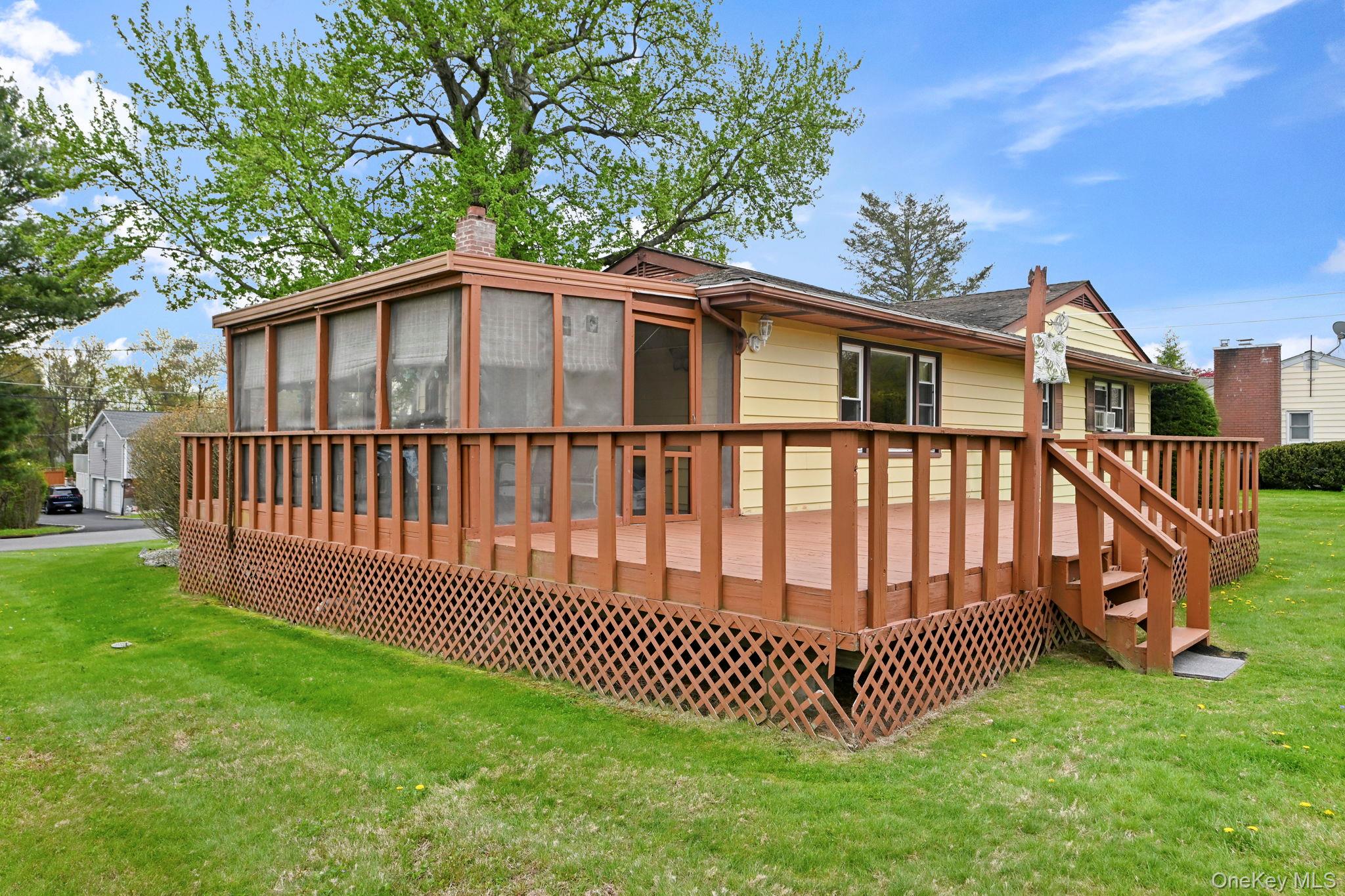 93 Fairmont Road Mahopac, NY 10541 - Photo 31 of 37 a view of a house with a yard and deck