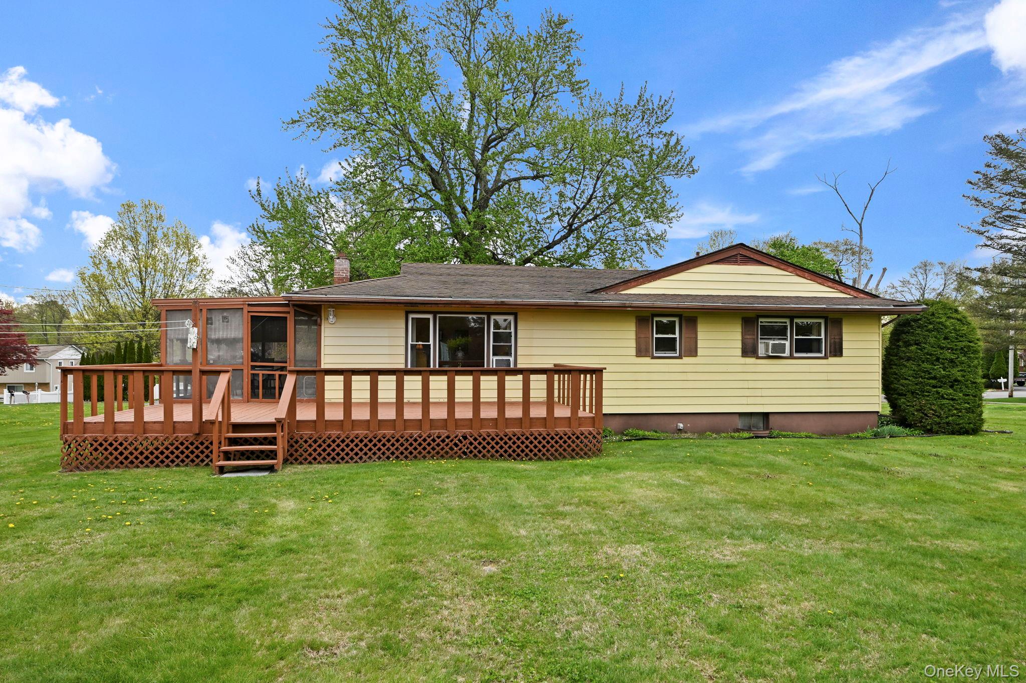 93 Fairmont Road Mahopac, NY 10541 - Photo 32 of 37 a front view of a house with a garden