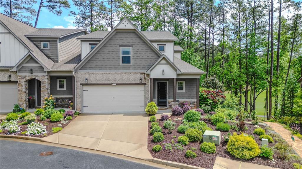 a front view of a house with a garden