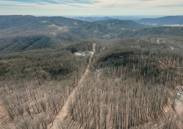 a view of a lake with mountains in the background