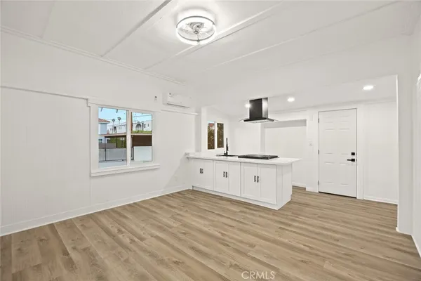 a kitchen with a stove a sink and a refrigerator