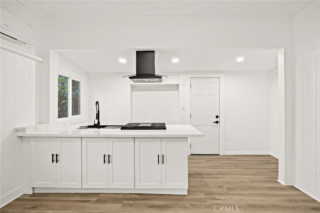 1412 Larch Street Alhambra, CA 91801 - Photo 6 of 28 a kitchen with stainless steel appliances granite countertop a sink a stove and a wooden floors