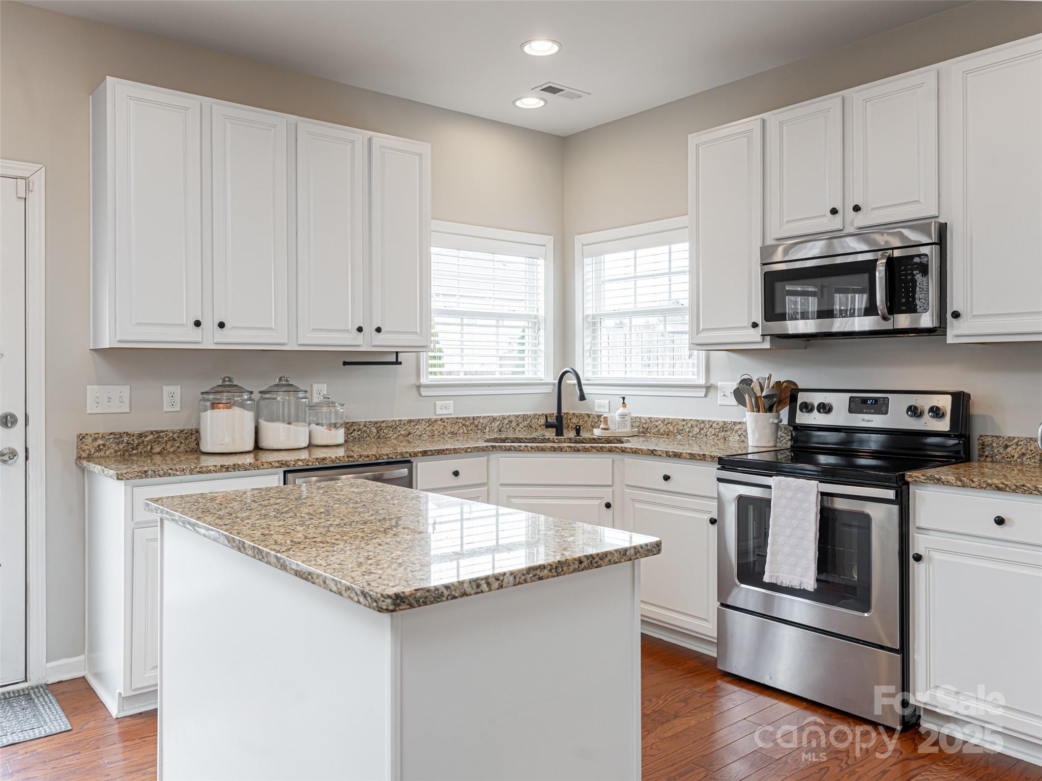289 Roanoke Road Fletcher, NC 28732 - Photo 15 of 39 a kitchen with stainless steel appliances granite countertop a sink stove and microwave