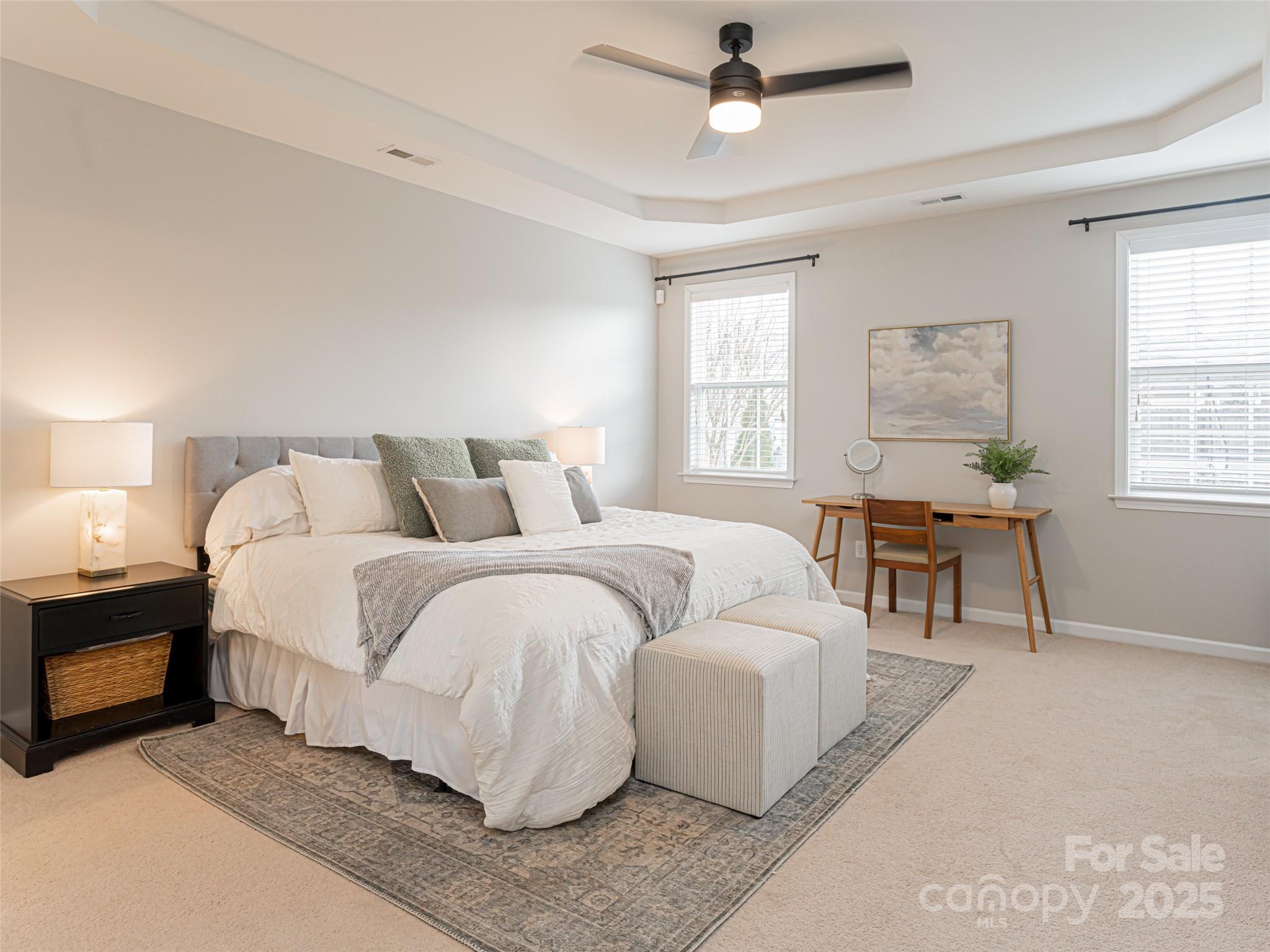 289 Roanoke Road Fletcher, NC 28732 - Photo 18 of 39 a spacious bedroom with a bed and a chandelier