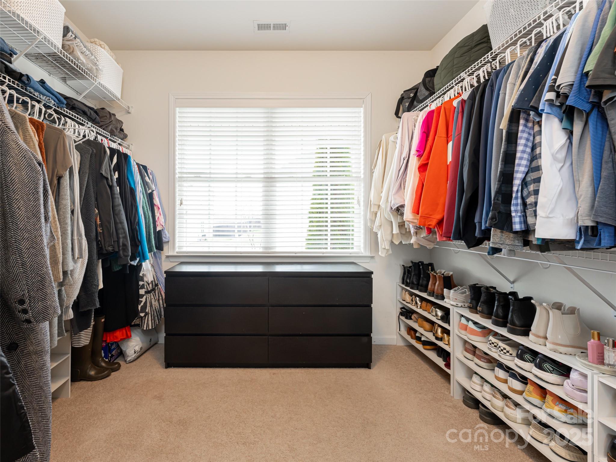 289 Roanoke Road Fletcher, NC 28732 - Photo 22 of 39 a view of walk in closet with clothes and shoes