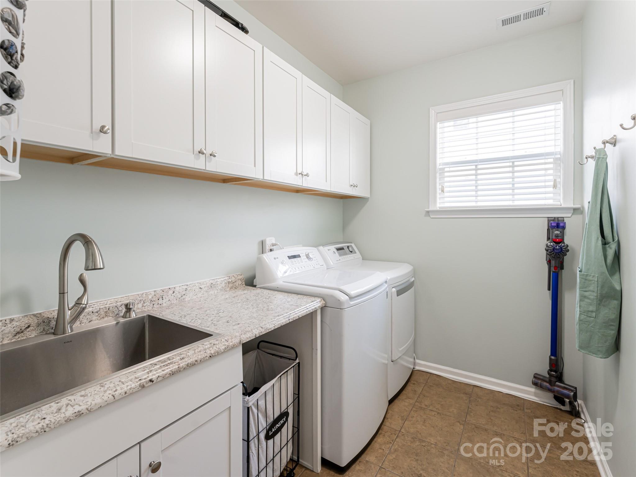 289 Roanoke Road Fletcher, NC 28732 - Photo 23 of 39 a view of a sink and washer
