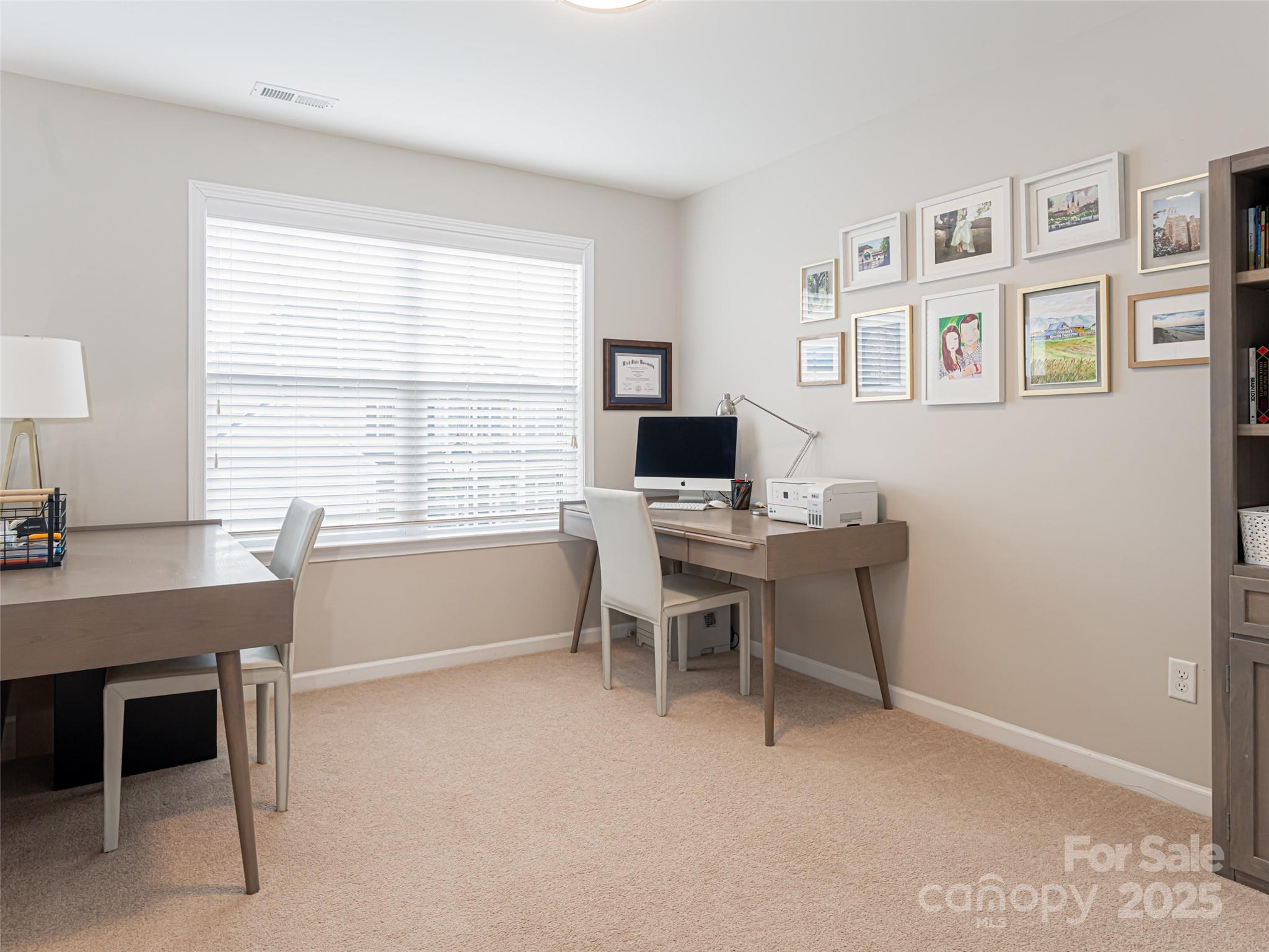 289 Roanoke Road Fletcher, NC 28732 - Photo 27 of 39 a view of a workspace with furniture and a window