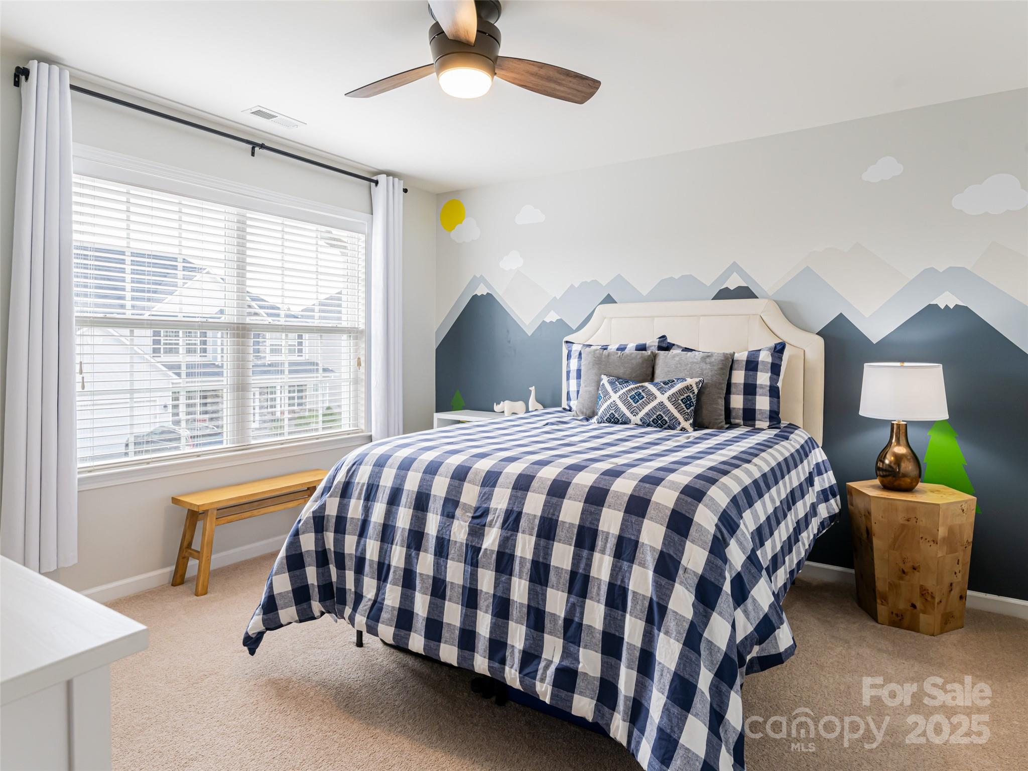 289 Roanoke Road Fletcher, NC 28732 - Photo 28 of 39 a bedroom with a bed and a chandelier
