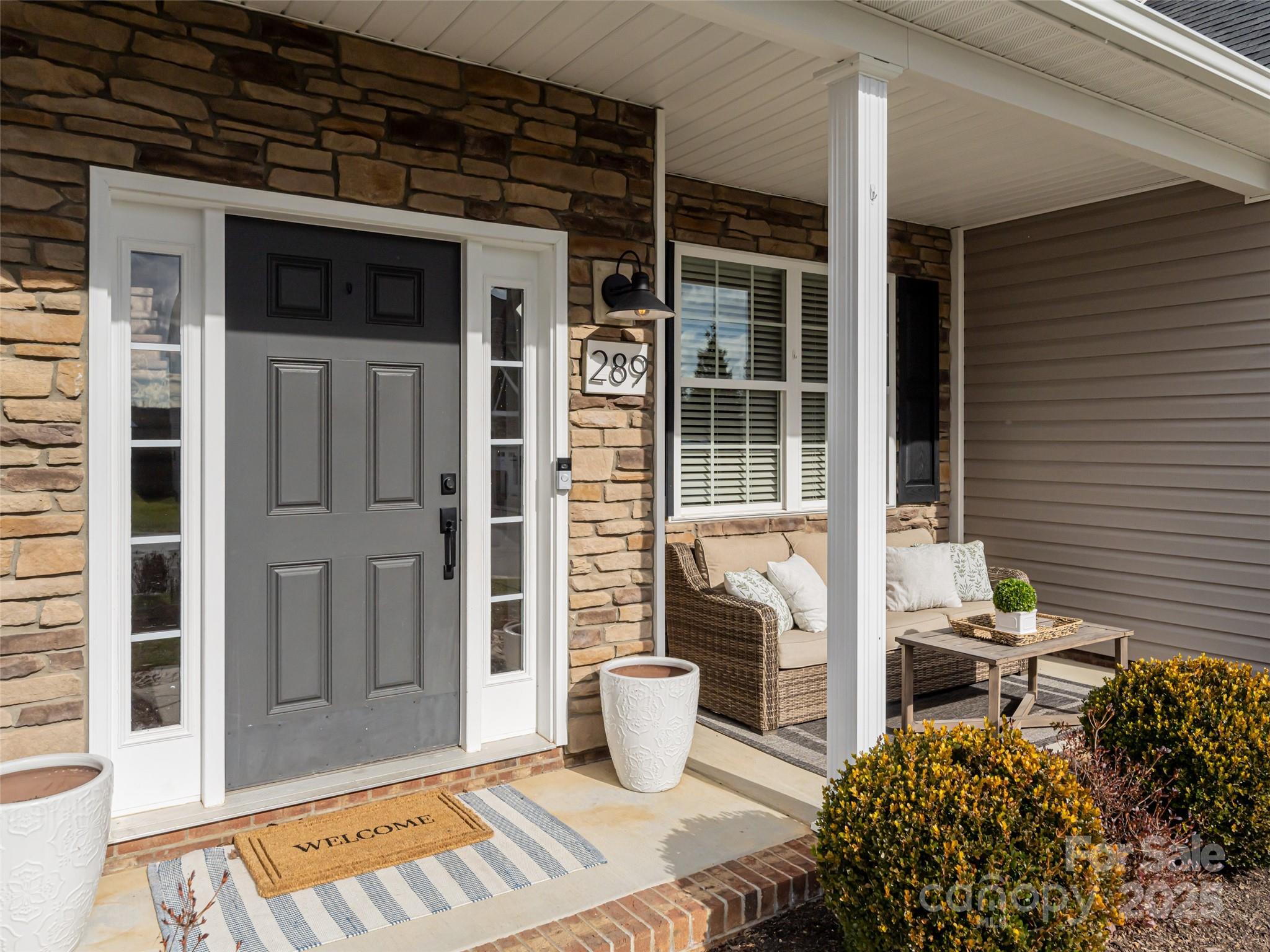 289 Roanoke Road Fletcher, NC 28732 - Photo 3 of 39 a view of a entryway door front of house