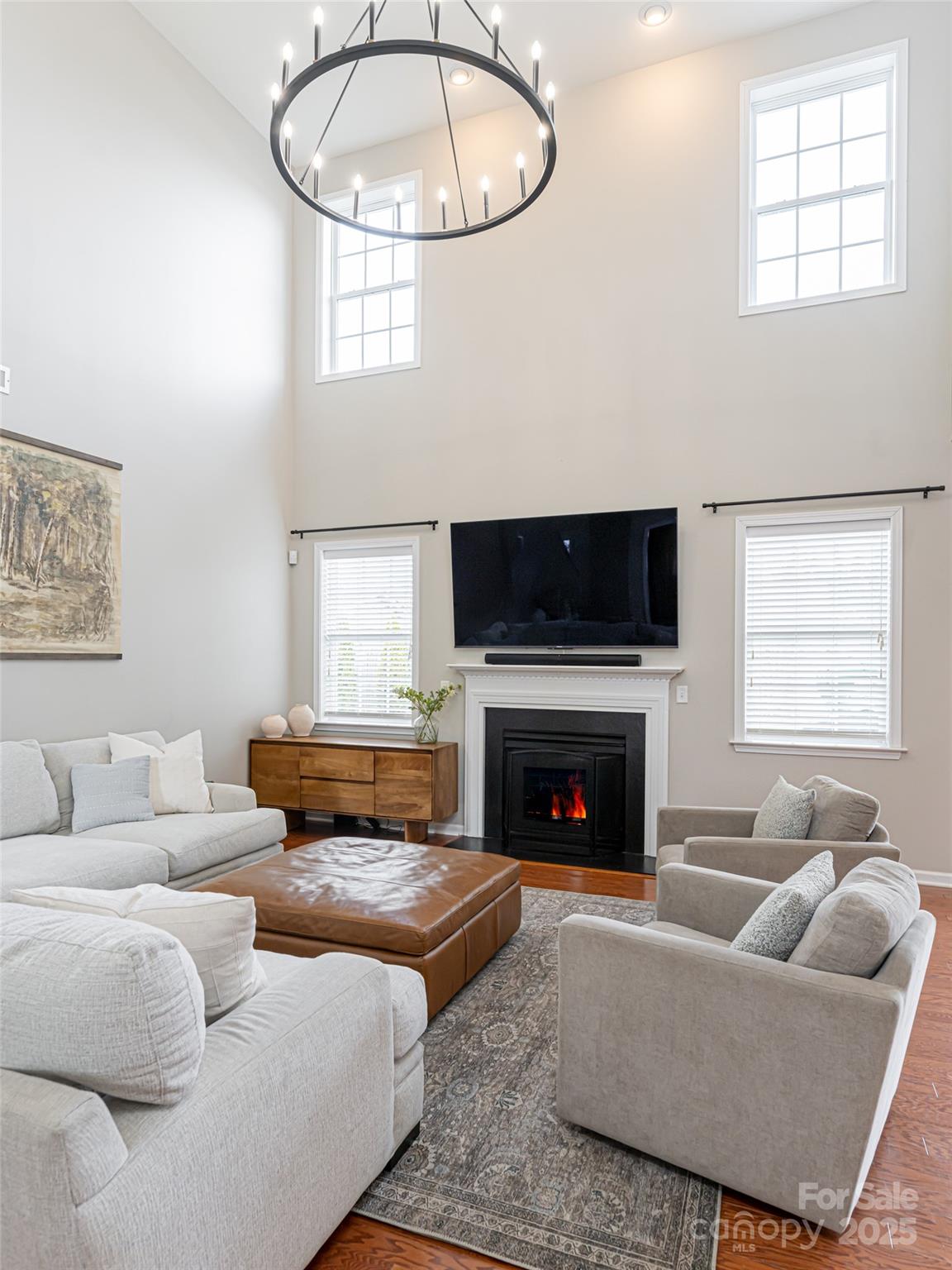 289 Roanoke Road Fletcher, NC 28732 - Photo 10 of 39 a living room with furniture a fireplace and a large window