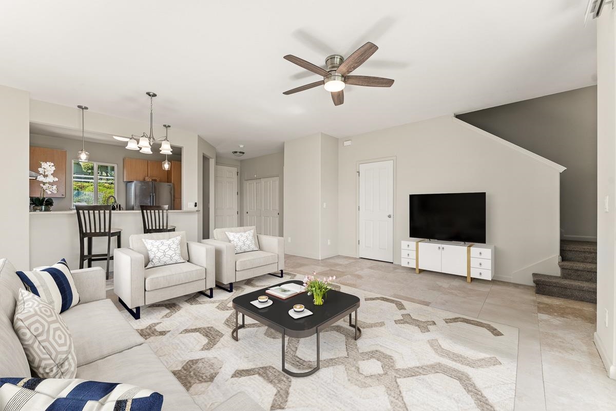 5 Kamauhalii Way, Unit 3D Wailuku, HI 96793 - Photo 1 of 31 a living room with furniture a rug and a flat screen tv