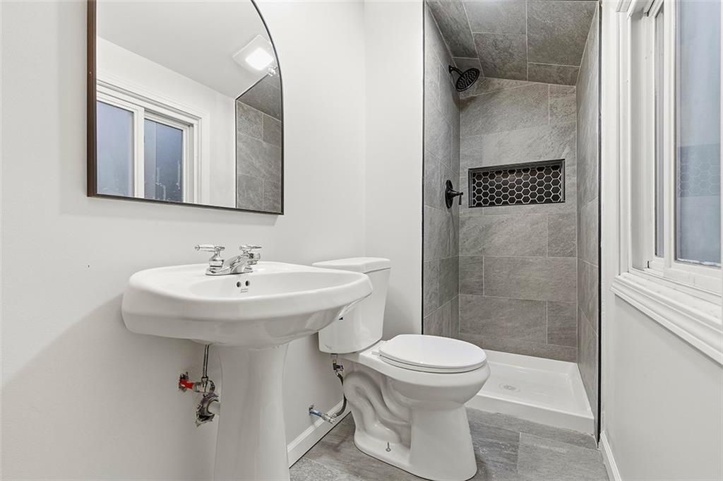 924 Old Hills Road McKeesport, PA 15135 - Photo 17 of 20 a bathroom with a sink toilet and shower