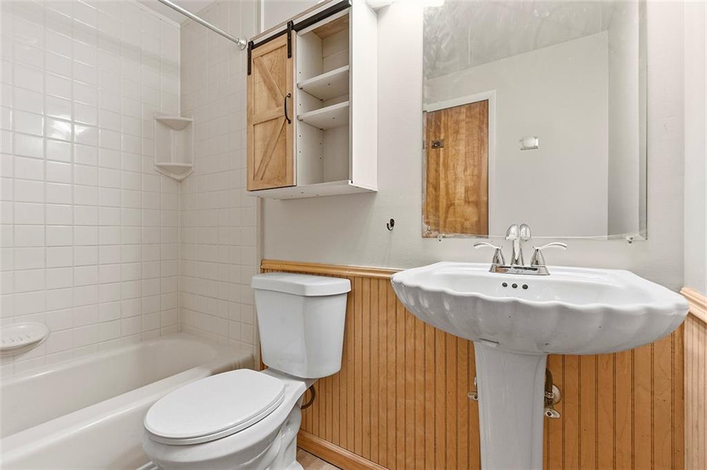 924 Old Hills Road McKeesport, PA 15135 - Photo 18 of 20 a bathroom with a sink toilet and shower