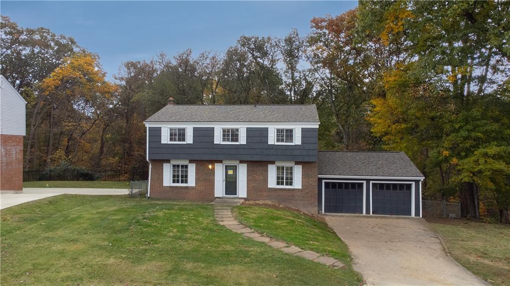 924 Old Hills Road McKeesport, PA 15135 - Photo 2 of 20 front view of a house with a yard